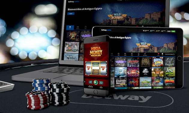 Un ordenador, una tablet y un móvil con juegos del casino Betway en su pantalla