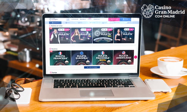 Ordenador portátil con la página web de Casino Gran Madrid en la pantalla